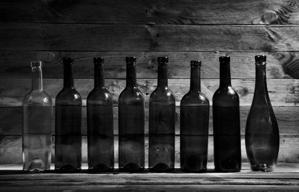 Old wine bottles in the dark.