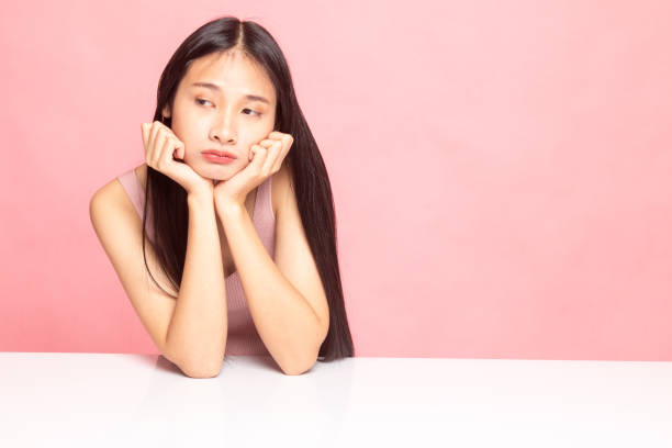 istock Asian girl with sad emotion. 1129589470