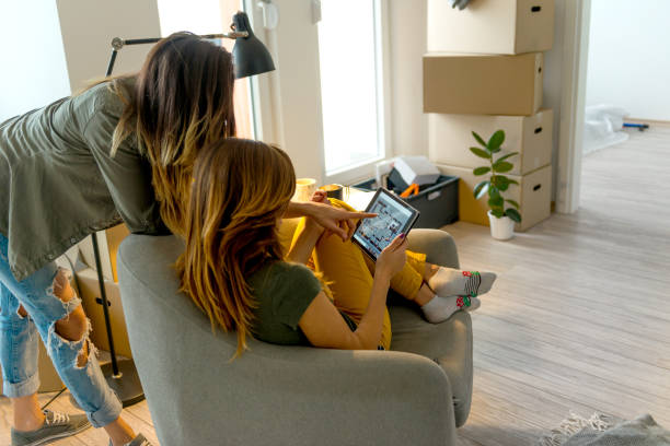 istock Lesbian couple moving into a new apartment 1129590946