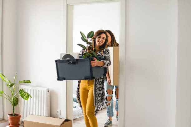istock Lesbian couple moving into a new apartment 1129592682