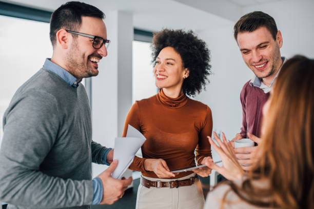 istock Young man with coworkers 1129594900
