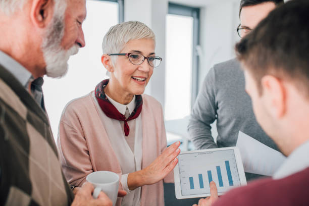 istock Business people looking at diagram 1129594950
