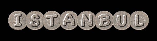 istock ISTANBUL word with old coins on black background 1129595067