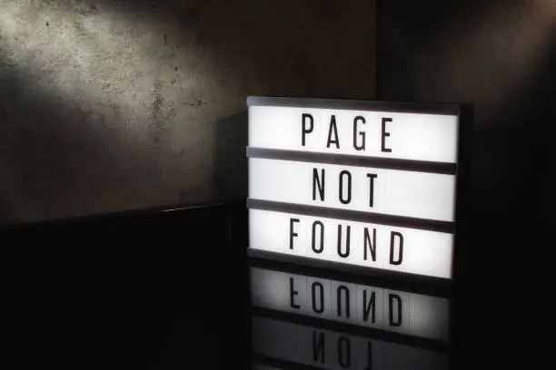 Page not found message on a light box with a dark cinematic feel