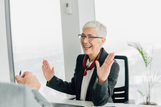 istock Senior business woman smiling 1129599391