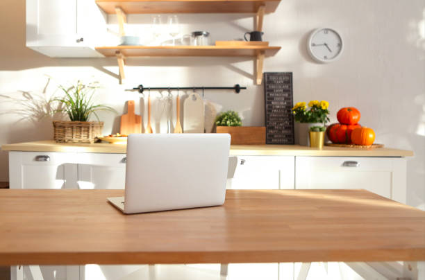 istock Closeup of laptop on kitchen counter 1129601746