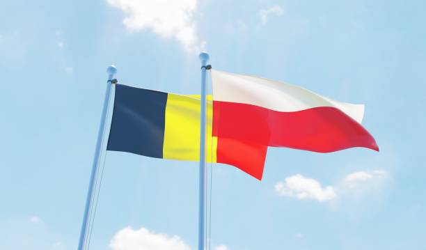 istock Poland and Belgium, two flags waving against blue sky 1129602890