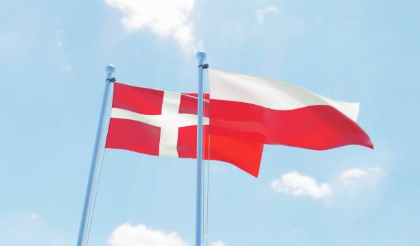istock Poland and Denmark, two flags waving against blue sky 1129602925
