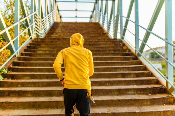 istock Young Athlete Running on the Stairways 1129603039