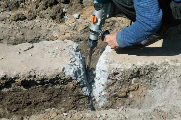 istock Worker hammer smashes the concrete foundation 1129603162