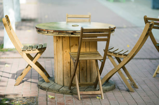 istock wooden chairs close-up in a street cafe fall 1129603182