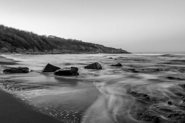 istock black and white sea landscape in the blue hour with dramatic sky and beautiful clouds. 1129604961
