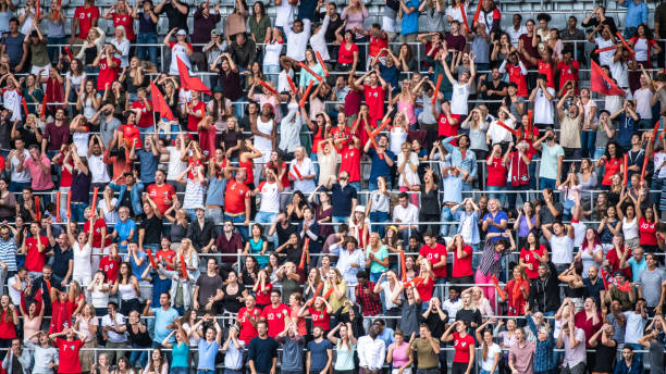 istock Spectators watching football match 1129607849