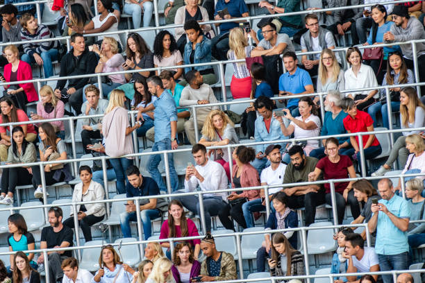 istock Group of spectators at stadium 1129607862