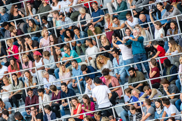 istock Group of spectators at stadium 1129607863