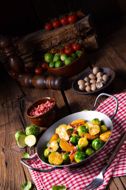 istock Brussels sprouts potato pan with bacon in rustic style 1129609546