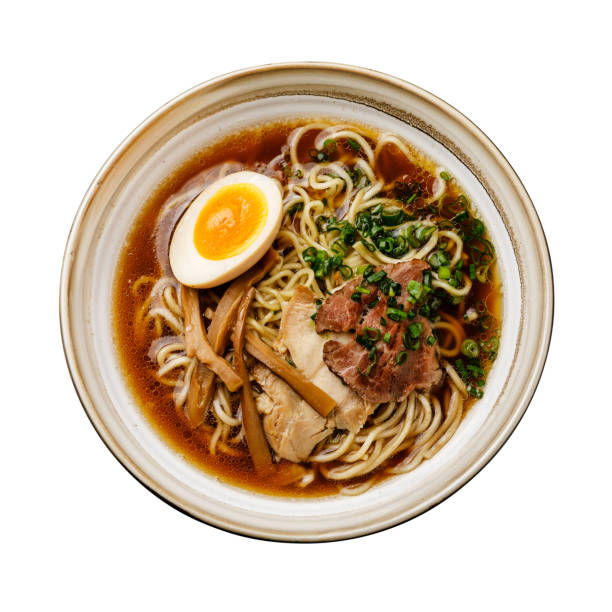 istock Ramen asian noodle in broth with meat and Ajitama pickled egg in bowl isolate 1129610271