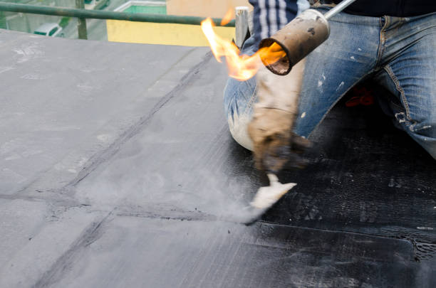 laying of waterproofing sheathing  and insulation on a roof stock photo