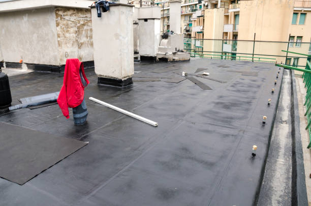 istock laying of waterproofing sheathing  and insulation on a roof 1129613297