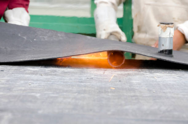 istock laying of waterproofing sheathing  and insulation on a roof 1129613306
