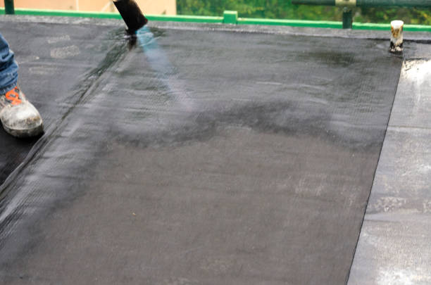 istock laying of waterproofing sheathing  and insulation on a roof 1129613311