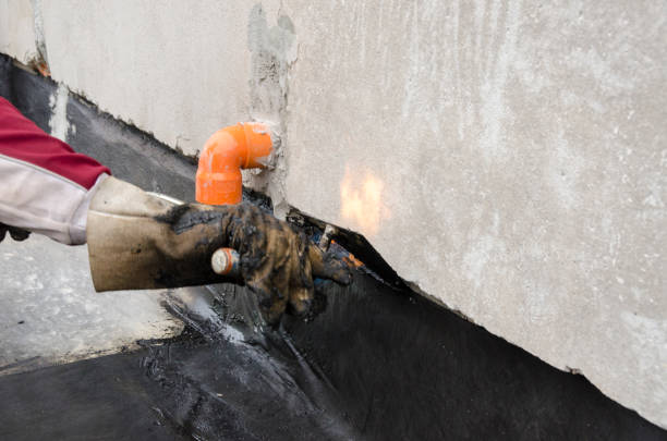 istock laying of waterproofing sheathing  and insulation on a roof 1129613312