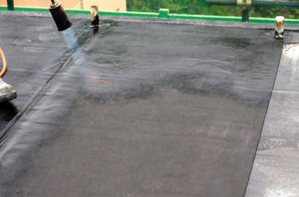 istock laying of waterproofing sheathing  and insulation on a roof 1129613315