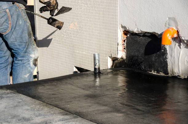 istock laying of waterproofing sheathing  and insulation on a roof 1129613316