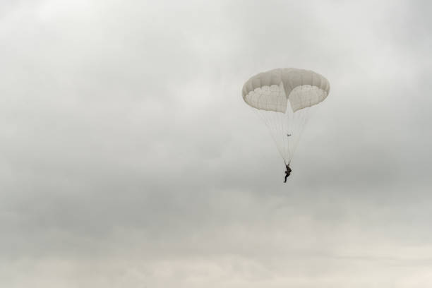 Pyatigorsk, RUSSIA - August 20, 2017: Military parachute jumper flying in cloudy sky.