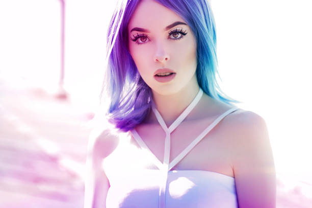 istock Young woman in neon lights 1129620342