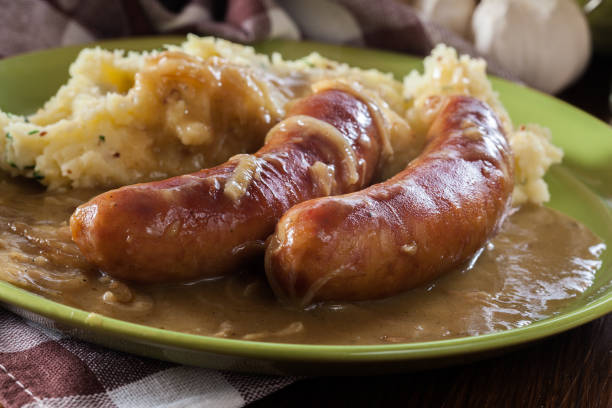 istock Bangers and Mash. Baked sausage in onion gravy 1129620839