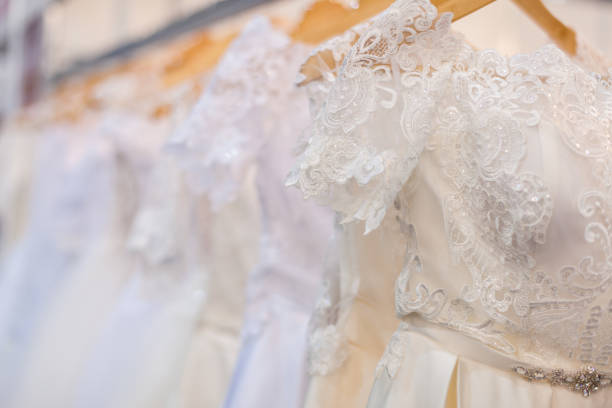 istock Wedding dresses in the wedding salon. 1129624376