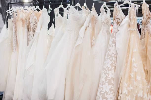 istock Stand with gorgeous wedding dresses. 1129624528
