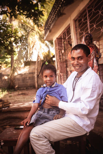 istock Doctor meet African child 1129629028