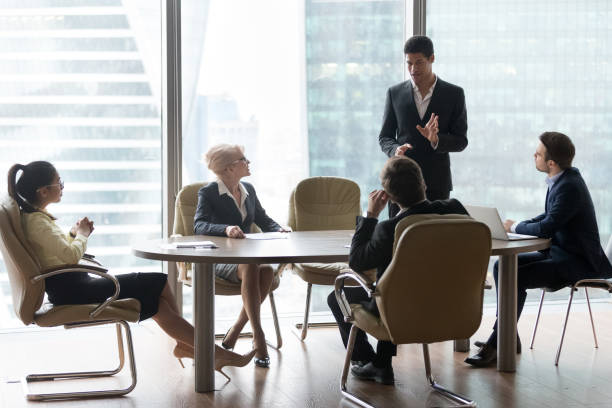 istock African american manager speaking at diverse board team meeting 1129629335