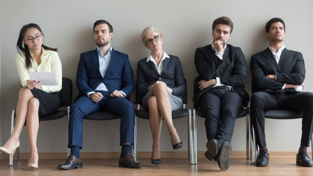istock Diverse applicants waiting for their turn preparing for job interview 1129629360