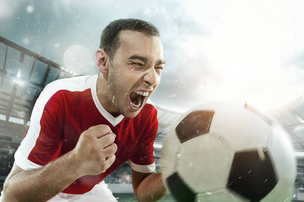 istock Happiness football player after goal. 1129629937