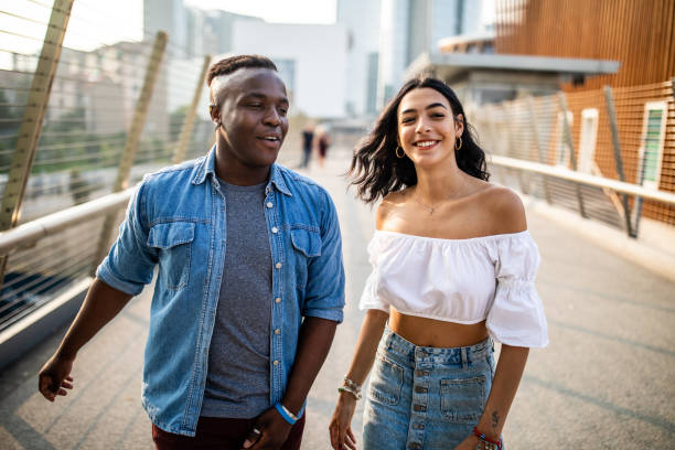istock Interracial couple walking in Milan 1129631541