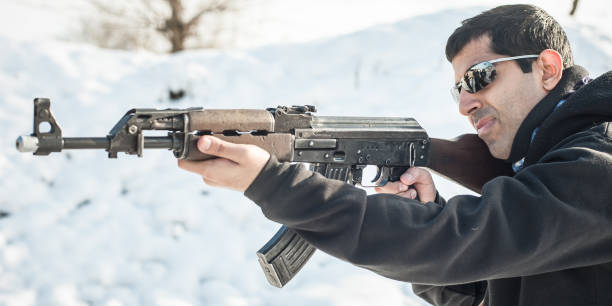 istock Front view gun point riffle machine gun. Shooting and weapons 1129631589