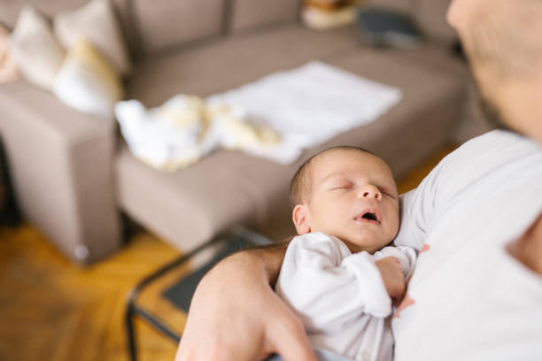 istock Newborn Baby Boy in Daddy's Hands 1129631933