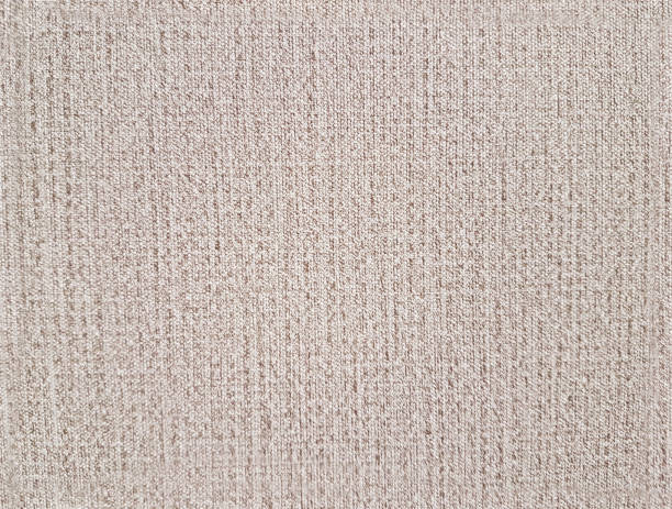 istock flax background. close up of abstract fabric texture as background for interior design. Production of natural fabrics. Technology of weaving from plant fibers. Interior decoration and clothing design 1129632169