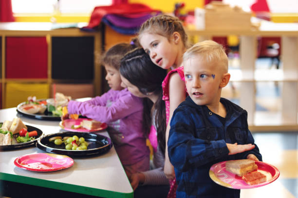 istock Children having lunch at the kindergarden 1129632533