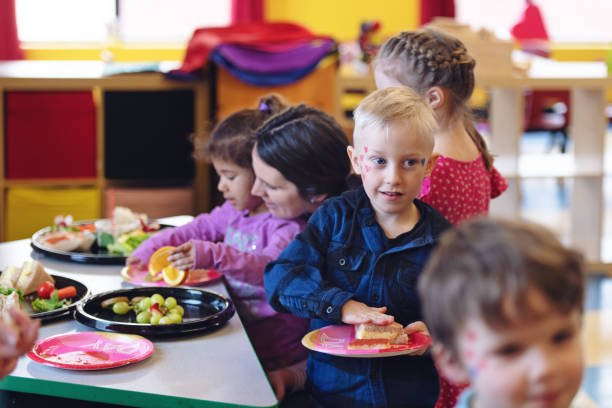 istock Children having lunch at the kindergarden 1129632545