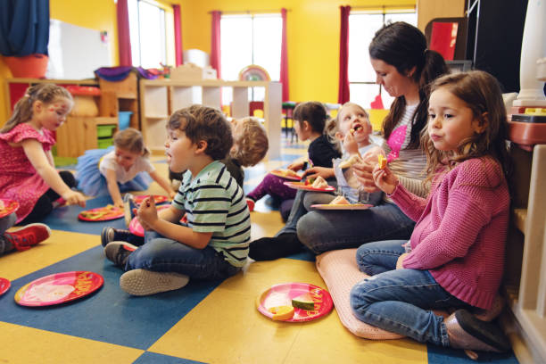 istock Children having lunch at the kindergarden 1129632599