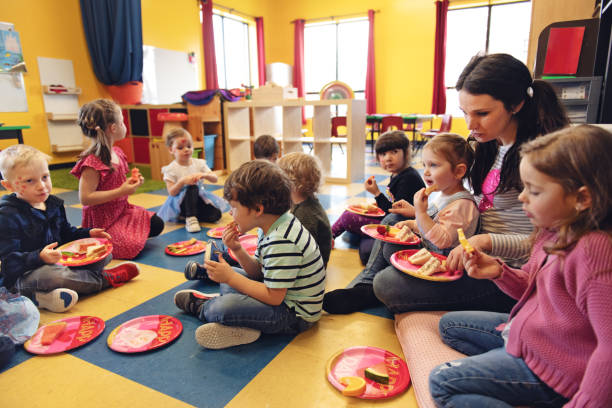 istock Children having lunch at the kindergarden 1129632605