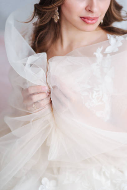 istock Vertical shot with bride's hands in focus. Wedding concepts, details, ideas and themes, bride morning 1129633968