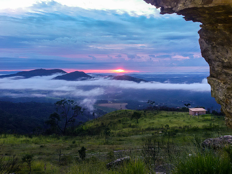 Sao Thomé das Letras - Minas Gerais - Brazil - 03/07/2015 - View of sunrise on the horizon with mountains and fog.