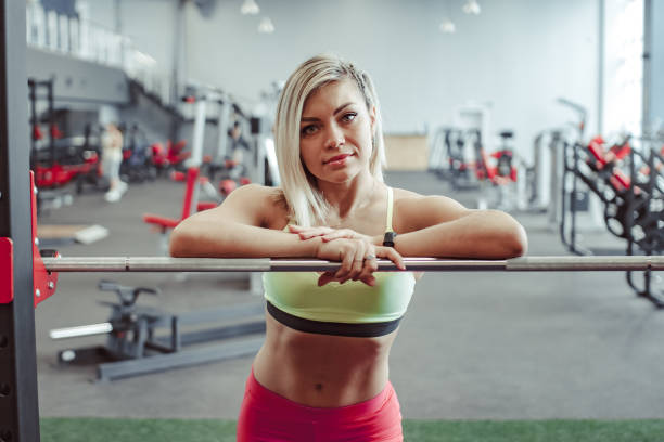 istock girl standing in the gym 1129636638