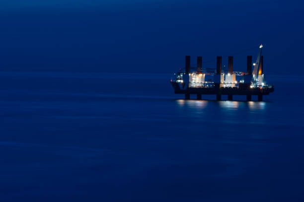 istock WInd Turbine Platform Vessel on Stilts at Twilight 1129637211