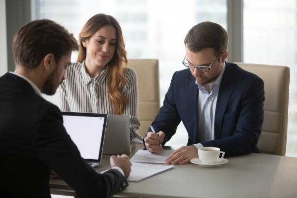 istock Business partners sign contracts after successful negotiations in office 1129638552